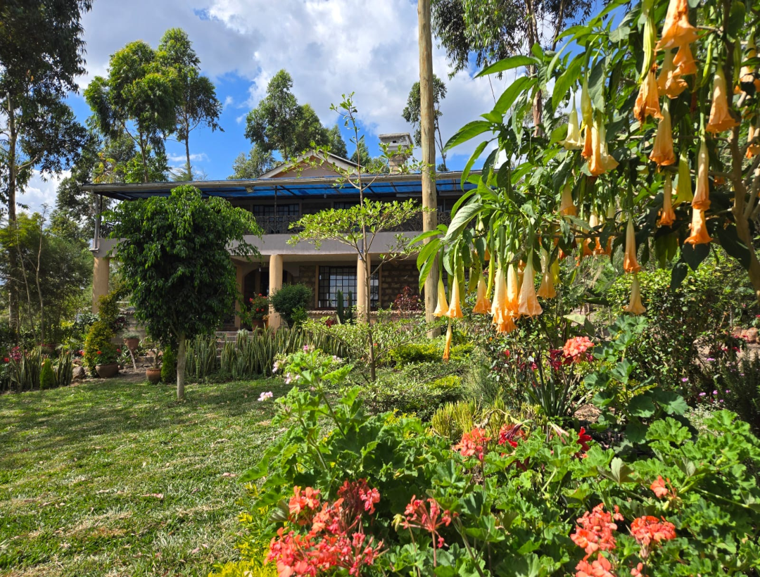 Beautiful garden house surrounded by flowers