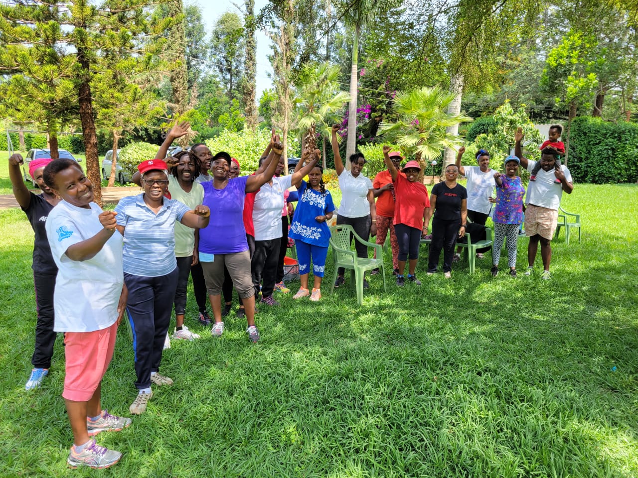Group of people enjoying team-building activities on the lawn